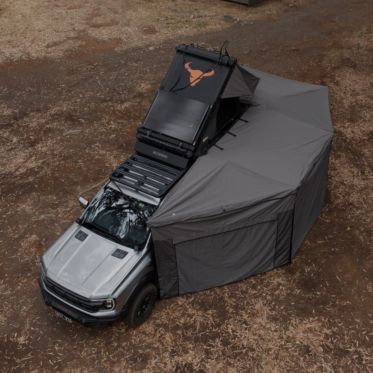 Aerial view of a Ford Ranger Raptor with a rooftop tent and the Iron Element 270 XL awning with walls fitted